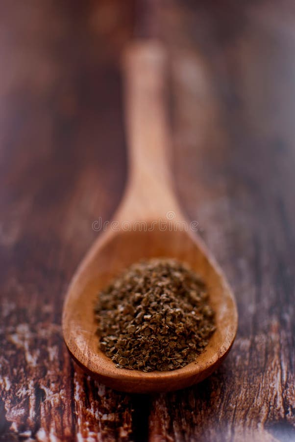 Marjoram Powder on Wooden Spoon Isolated on White Stock Image Image