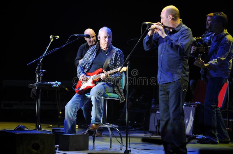 Famous British guitarist Mark Knopfler (sitting) during his performance in Prague, June 26, 2010