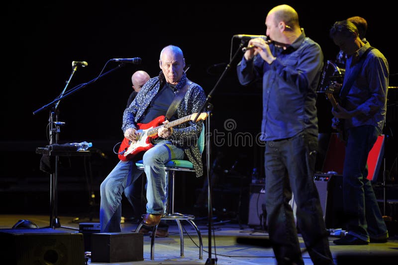 Famous British guitarist Mark Knopfler (sitting) during his performance in Prague, June 26, 2010