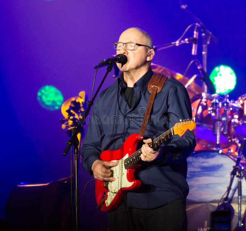 BARCELONA, SPAIN - APRIL 26, 2019: Mark Knopfler during performance at Palau Sant Jordi, Barcelona. BARCELONA, SPAIN - APRIL 26, 2019: Mark Knopfler during performance at Palau Sant Jordi, Barcelona