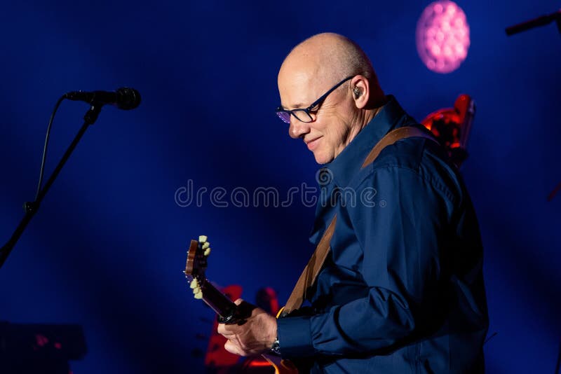 BARCELONA - APR 25: Mark Knopfler performs in concert at Palau Sant Jordi on April 25, 2019 in Barcelona, Spain. BARCELONA - APR 25: Mark Knopfler performs in concert at Palau Sant Jordi on April 25, 2019 in Barcelona, Spain