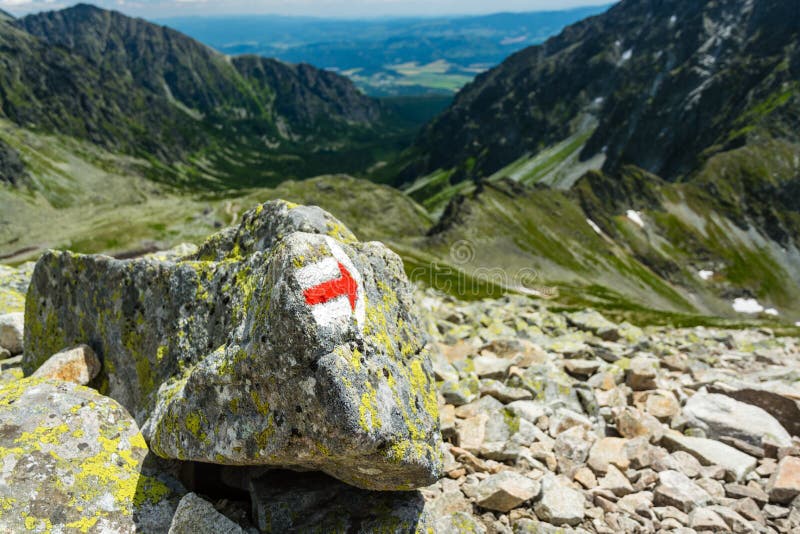 Marker with correct direction on high mountain trail below Koprovsky peak