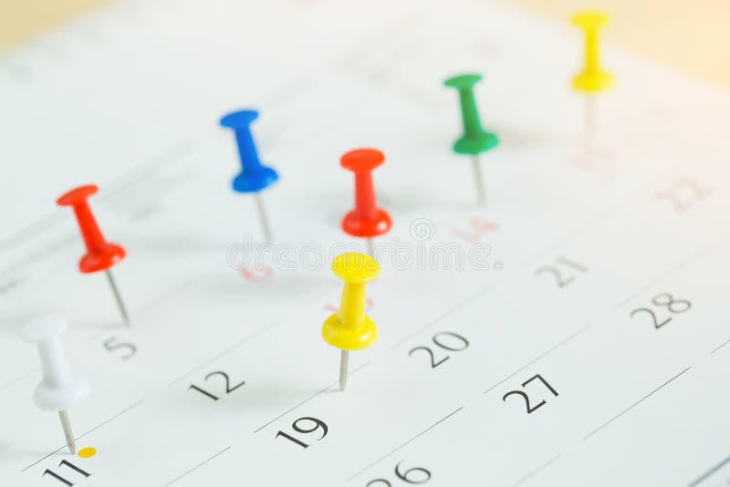 Mark the event day with a pin. Thumbtack in calendar concept for busy timeline organize schedule,appointment meeting reminder. planning business meeting or travel holiday planning concept. soft focus. Mark the event day with a pin. Thumbtack in calendar concept for busy timeline organize schedule,appointment meeting reminder. planning business meeting or travel holiday planning concept. soft focus