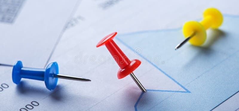 Marking financial chart by pins. Share listing and checking financial chart. Concept of banking, financial report and financial royalty free stock photos