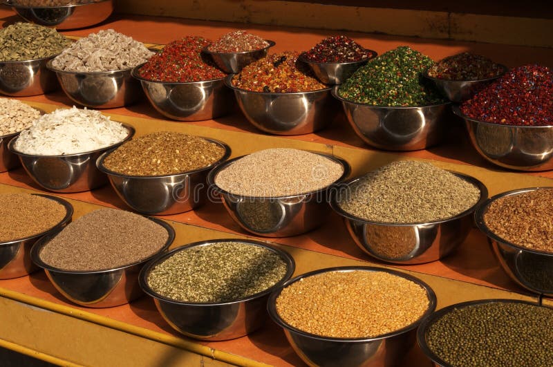 Bowls of pulses and spices on a market stall in Ahmadabad, Gujarat, India. Bowls of pulses and spices on a market stall in Ahmadabad, Gujarat, India