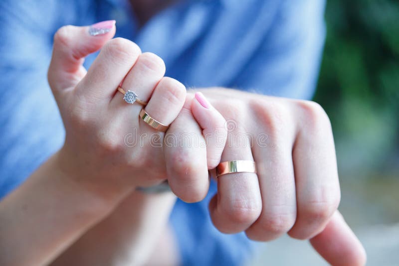 Married Couple  Hands  With Wedding  Rings  Stock Photo 