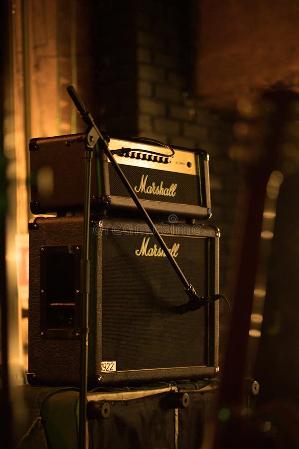 Marshall 100W half stack tube amp head with cabinet, guitar amp on the stage.