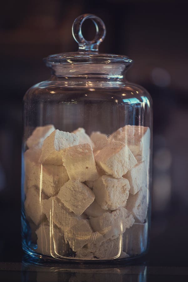 Marshmallows in glass jar stock image. Image of light 85685549