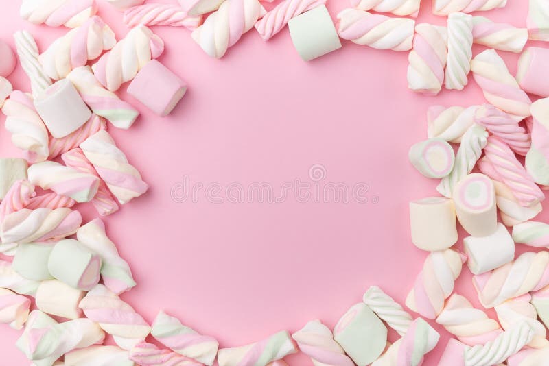 Marshmallows on tender pink background