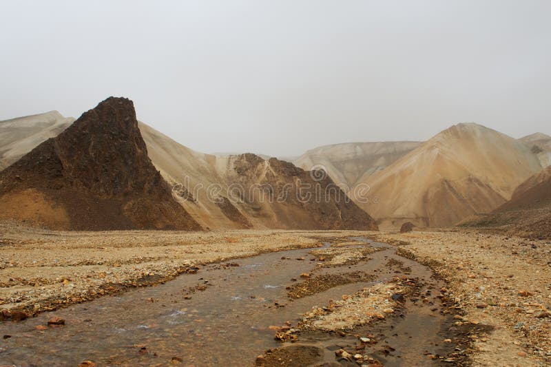 Marsian landscape: yellow and orange rocks during the sand storm