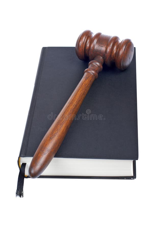 Wooden gavel from the court and law book isolated on white background. Shallow DOF. Wooden gavel from the court and law book isolated on white background. Shallow DOF