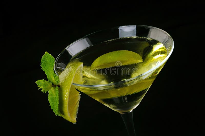 Martini cocktail with lime stock photo. Image of slice 35270292
