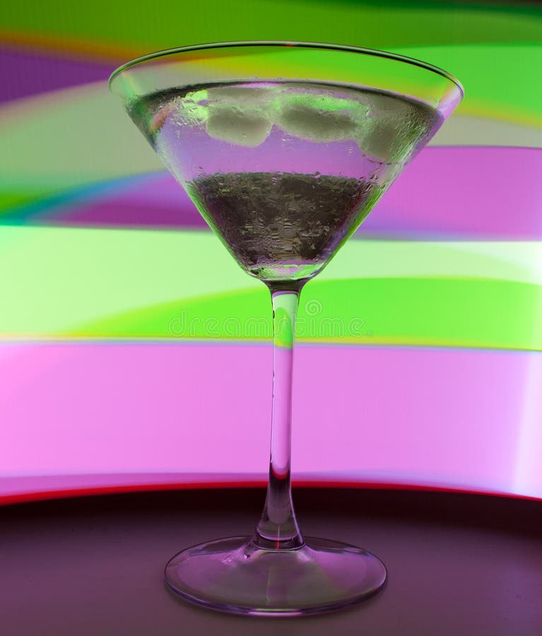 A Martini Glass with a Cocktail in Beautiful Light of Different Colors