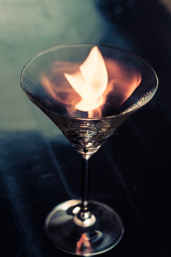 Fire on martini glass stock photo. Image of alcohol, liquor 5544686