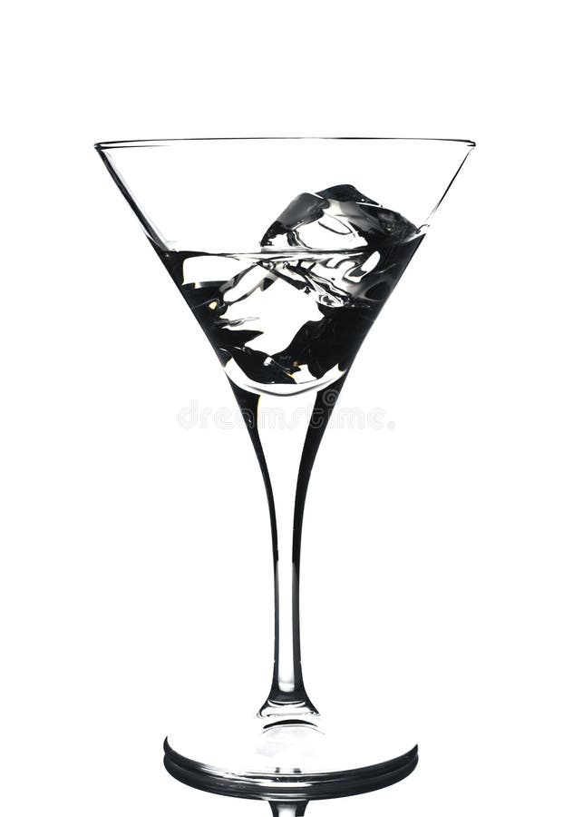 Martini glass with ice cubes and some drink