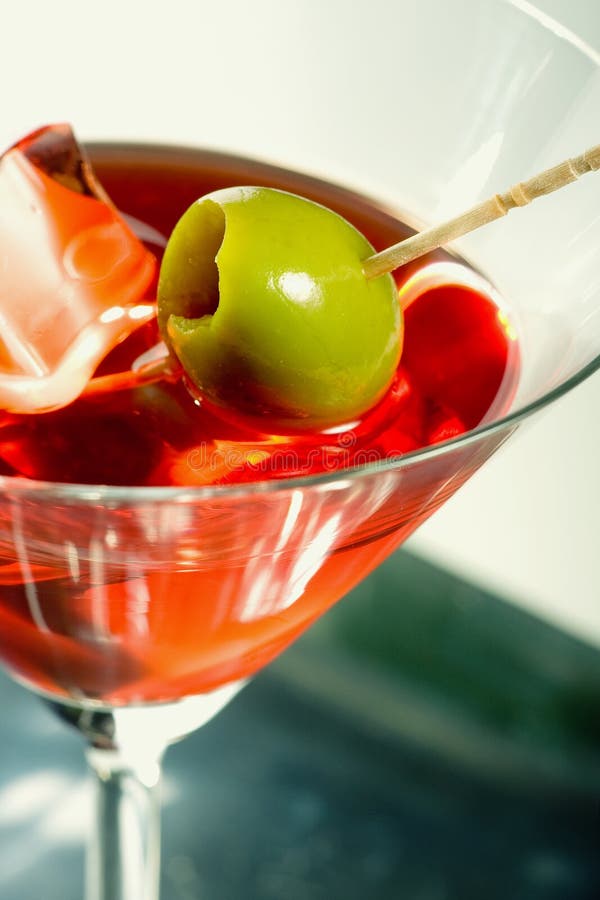 Martini glass with olive stock photo. Image of berry, mixed 6837454