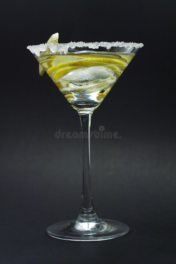 Martini with sugar crust, lemon and peels on black