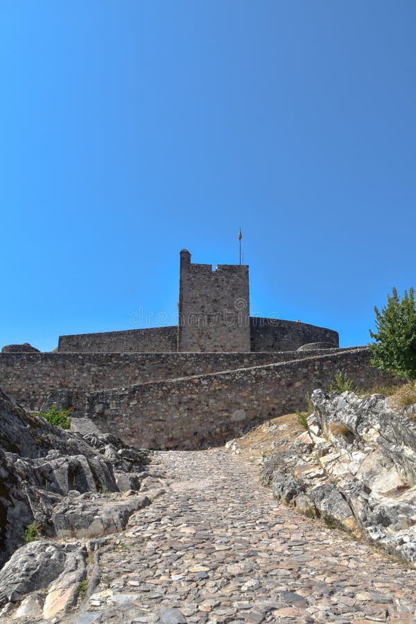 MarvÃ£o  is a municipality in Portalegre District in Portugal. The population in 2020 was 2,972 and dropping at a rate of around one inhabitant per week, in an area of 154.90 km2. The present Mayor is LuÃ­s Vitorino, elected by the Social Democratic Party. The municipal holiday is September 8.

Perched on a quartzite crag of the Serra de SÃ£o Mamede, MarvÃ£o`s name is derived from an 8th-century Muwallad rebel, named Ibn Marwan. Ibn Marwan, who constructed the Castle of MarvÃ£o - likely on the site of an earlier Roman watchtower - as a power base when establishing an independent statelet `emirate`, duchy - covering much of modern-day Portugal - during the Emirate of Cordoba 884-931 CE. The castle and walled village were further fortified through the centuries, notably under Sancho II of Portugal 13th century and Denis of Portugal.

The village has generated significant tourist interest in recent years. It was included in the #1 New York Times bestselling book, 1000 Places to see Before you Die.[3] Nobel Prize-winning author JosÃ© Saramago wrote of the village, `From MarvÃ£o one can see the entire land ... It is understandable that from this place, high up in the keep at MarvÃ£o Castle, visitors may respectfully murmur, `How great is the world`.`. MarvÃ£o  is a municipality in Portalegre District in Portugal. The population in 2020 was 2,972 and dropping at a rate of around one inhabitant per week, in an area of 154.90 km2. The present Mayor is LuÃ­s Vitorino, elected by the Social Democratic Party. The municipal holiday is September 8.

Perched on a quartzite crag of the Serra de SÃ£o Mamede, MarvÃ£o`s name is derived from an 8th-century Muwallad rebel, named Ibn Marwan. Ibn Marwan, who constructed the Castle of MarvÃ£o - likely on the site of an earlier Roman watchtower - as a power base when establishing an independent statelet `emirate`, duchy - covering much of modern-day Portugal - during the Emirate of Cordoba 884-931 CE. The castle and walled village were further fortified through the centuries, notably under Sancho II of Portugal 13th century and Denis of Portugal.

The village has generated significant tourist interest in recent years. It was included in the #1 New York Times bestselling book, 1000 Places to see Before you Die.[3] Nobel Prize-winning author JosÃ© Saramago wrote of the village, `From MarvÃ£o one can see the entire land ... It is understandable that from this place, high up in the keep at MarvÃ£o Castle, visitors may respectfully murmur, `How great is the world`.`