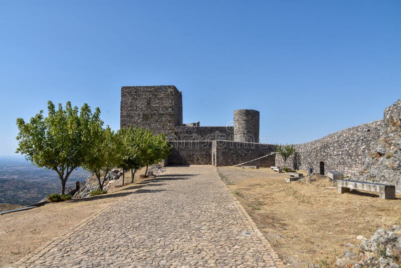MarvÃ£o  is a municipality in Portalegre District in Portugal. The population in 2020 was 2,972 and dropping at a rate of around one inhabitant per week, in an area of 154.90 km2. The present Mayor is LuÃ­s Vitorino, elected by the Social Democratic Party. The municipal holiday is September 8.

Perched on a quartzite crag of the Serra de SÃ£o Mamede, MarvÃ£o`s name is derived from an 8th-century Muwallad rebel, named Ibn Marwan. Ibn Marwan, who constructed the Castle of MarvÃ£o - likely on the site of an earlier Roman watchtower - as a power base when establishing an independent statelet `emirate`, duchy - covering much of modern-day Portugal - during the Emirate of Cordoba 884-931 CE. The castle and walled village were further fortified through the centuries, notably under Sancho II of Portugal 13th century and Denis of Portugal.

The village has generated significant tourist interest in recent years. It was included in the #1 New York Times bestselling book, 1000 Places to see Before you Die.[3] Nobel Prize-winning author JosÃ© Saramago wrote of the village, `From MarvÃ£o one can see the entire land ... It is understandable that from this place, high up in the keep at MarvÃ£o Castle, visitors may respectfully murmur, `How great is the world`.`. MarvÃ£o  is a municipality in Portalegre District in Portugal. The population in 2020 was 2,972 and dropping at a rate of around one inhabitant per week, in an area of 154.90 km2. The present Mayor is LuÃ­s Vitorino, elected by the Social Democratic Party. The municipal holiday is September 8.

Perched on a quartzite crag of the Serra de SÃ£o Mamede, MarvÃ£o`s name is derived from an 8th-century Muwallad rebel, named Ibn Marwan. Ibn Marwan, who constructed the Castle of MarvÃ£o - likely on the site of an earlier Roman watchtower - as a power base when establishing an independent statelet `emirate`, duchy - covering much of modern-day Portugal - during the Emirate of Cordoba 884-931 CE. The castle and walled village were further fortified through the centuries, notably under Sancho II of Portugal 13th century and Denis of Portugal.

The village has generated significant tourist interest in recent years. It was included in the #1 New York Times bestselling book, 1000 Places to see Before you Die.[3] Nobel Prize-winning author JosÃ© Saramago wrote of the village, `From MarvÃ£o one can see the entire land ... It is understandable that from this place, high up in the keep at MarvÃ£o Castle, visitors may respectfully murmur, `How great is the world`.`