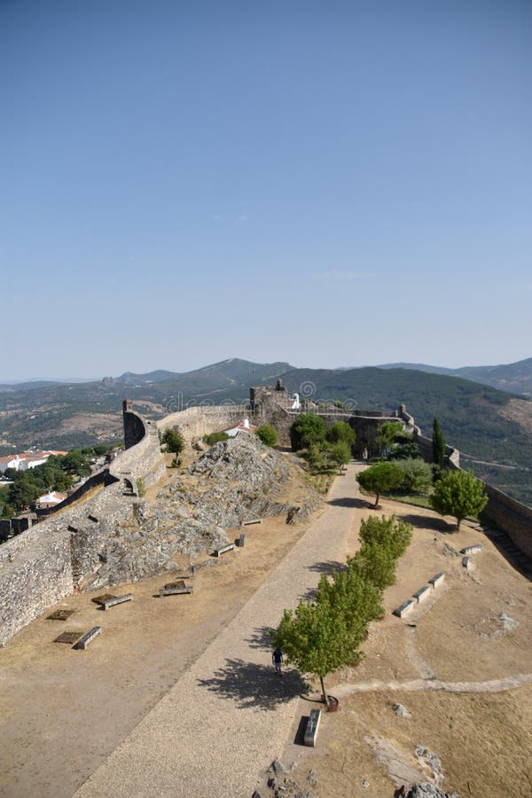 MarvÃ£o  is a municipality in Portalegre District in Portugal. The population in 2020 was 2,972 and dropping at a rate of around one inhabitant per week, in an area of 154.90 km2. The present Mayor is LuÃ­s Vitorino, elected by the Social Democratic Party. The municipal holiday is September 8.

Perched on a quartzite crag of the Serra de SÃ£o Mamede, MarvÃ£o`s name is derived from an 8th-century Muwallad rebel, named Ibn Marwan. Ibn Marwan, who constructed the Castle of MarvÃ£o - likely on the site of an earlier Roman watchtower - as a power base when establishing an independent statelet `emirate`, duchy - covering much of modern-day Portugal - during the Emirate of Cordoba 884-931 CE. The castle and walled village were further fortified through the centuries, notably under Sancho II of Portugal 13th century and Denis of Portugal.

The village has generated significant tourist interest in recent years. It was included in the #1 New York Times bestselling book, 1000 Places to see Before you Die.[3] Nobel Prize-winning author JosÃ© Saramago wrote of the village, `From MarvÃ£o one can see the entire land ... It is understandable that from this place, high up in the keep at MarvÃ£o Castle, visitors may respectfully murmur, `How great is the world`.`. MarvÃ£o  is a municipality in Portalegre District in Portugal. The population in 2020 was 2,972 and dropping at a rate of around one inhabitant per week, in an area of 154.90 km2. The present Mayor is LuÃ­s Vitorino, elected by the Social Democratic Party. The municipal holiday is September 8.

Perched on a quartzite crag of the Serra de SÃ£o Mamede, MarvÃ£o`s name is derived from an 8th-century Muwallad rebel, named Ibn Marwan. Ibn Marwan, who constructed the Castle of MarvÃ£o - likely on the site of an earlier Roman watchtower - as a power base when establishing an independent statelet `emirate`, duchy - covering much of modern-day Portugal - during the Emirate of Cordoba 884-931 CE. The castle and walled village were further fortified through the centuries, notably under Sancho II of Portugal 13th century and Denis of Portugal.

The village has generated significant tourist interest in recent years. It was included in the #1 New York Times bestselling book, 1000 Places to see Before you Die.[3] Nobel Prize-winning author JosÃ© Saramago wrote of the village, `From MarvÃ£o one can see the entire land ... It is understandable that from this place, high up in the keep at MarvÃ£o Castle, visitors may respectfully murmur, `How great is the world`.`