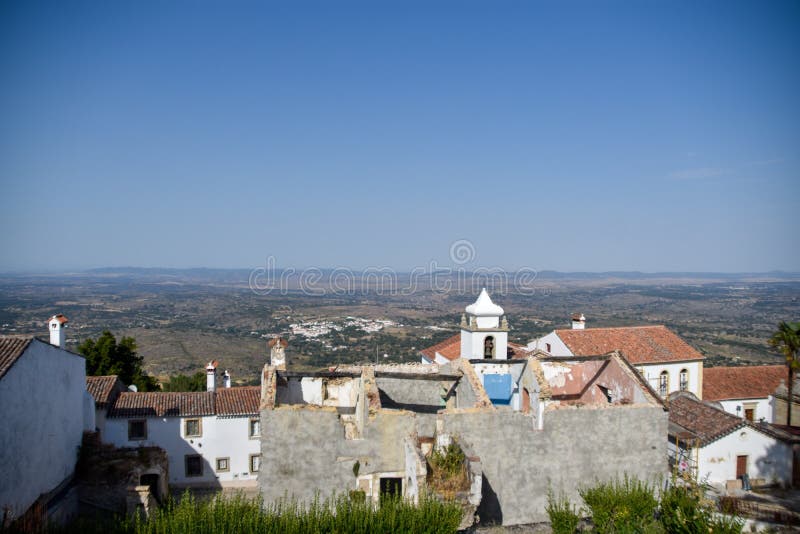 MarvÃ£o  is a municipality in Portalegre District in Portugal. The population in 2020 was 2,972 and dropping at a rate of around one inhabitant per week, in an area of 154.90 km2. The present Mayor is LuÃ­s Vitorino, elected by the Social Democratic Party. The municipal holiday is September 8.

Perched on a quartzite crag of the Serra de SÃ£o Mamede, MarvÃ£o`s name is derived from an 8th-century Muwallad rebel, named Ibn Marwan. Ibn Marwan, who constructed the Castle of MarvÃ£o - likely on the site of an earlier Roman watchtower - as a power base when establishing an independent statelet `emirate`, duchy - covering much of modern-day Portugal - during the Emirate of Cordoba 884-931 CE. The castle and walled village were further fortified through the centuries, notably under Sancho II of Portugal 13th century and Denis of Portugal.

The village has generated significant tourist interest in recent years. It was included in the #1 New York Times bestselling book, 1000 Places to see Before you Die.[3] Nobel Prize-winning author JosÃ© Saramago wrote of the village, `From MarvÃ£o one can see the entire land ... It is understandable that from this place, high up in the keep at MarvÃ£o Castle, visitors may respectfully murmur, `How great is the world`.`. MarvÃ£o  is a municipality in Portalegre District in Portugal. The population in 2020 was 2,972 and dropping at a rate of around one inhabitant per week, in an area of 154.90 km2. The present Mayor is LuÃ­s Vitorino, elected by the Social Democratic Party. The municipal holiday is September 8.

Perched on a quartzite crag of the Serra de SÃ£o Mamede, MarvÃ£o`s name is derived from an 8th-century Muwallad rebel, named Ibn Marwan. Ibn Marwan, who constructed the Castle of MarvÃ£o - likely on the site of an earlier Roman watchtower - as a power base when establishing an independent statelet `emirate`, duchy - covering much of modern-day Portugal - during the Emirate of Cordoba 884-931 CE. The castle and walled village were further fortified through the centuries, notably under Sancho II of Portugal 13th century and Denis of Portugal.

The village has generated significant tourist interest in recent years. It was included in the #1 New York Times bestselling book, 1000 Places to see Before you Die.[3] Nobel Prize-winning author JosÃ© Saramago wrote of the village, `From MarvÃ£o one can see the entire land ... It is understandable that from this place, high up in the keep at MarvÃ£o Castle, visitors may respectfully murmur, `How great is the world`.`