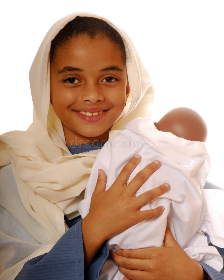 Beautiful biracial child playing the role of Mary with her baby, Jesus, in a Nativity scene. Beautiful biracial child playing the role of Mary with her baby, Jesus, in a Nativity scene.