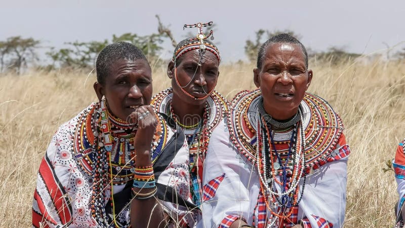 MASAI MARA, KENYA- 26, AUGUST, 2016: close up of maasai women in traditional dress at koiyaki guiding school in kenya royalty free stock image MASAI MARA, KENYA- 26, AUGUST, 2016: close up of maasai women in traditional dress at koiyaki guiding school in kenya royalty free stock image