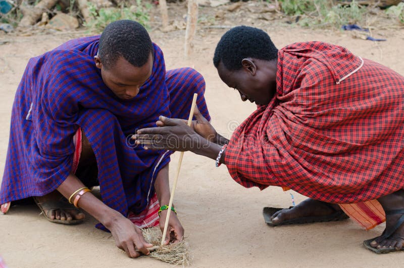 Masai who light the fire stock photos