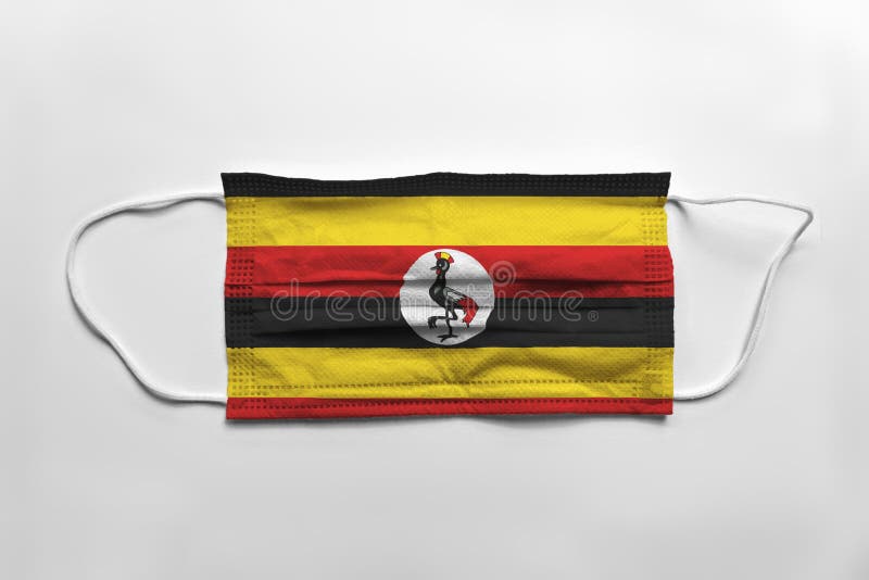 Mască de față cu drapelul din Uganda imprimată pe fond alb izolat stock illustration