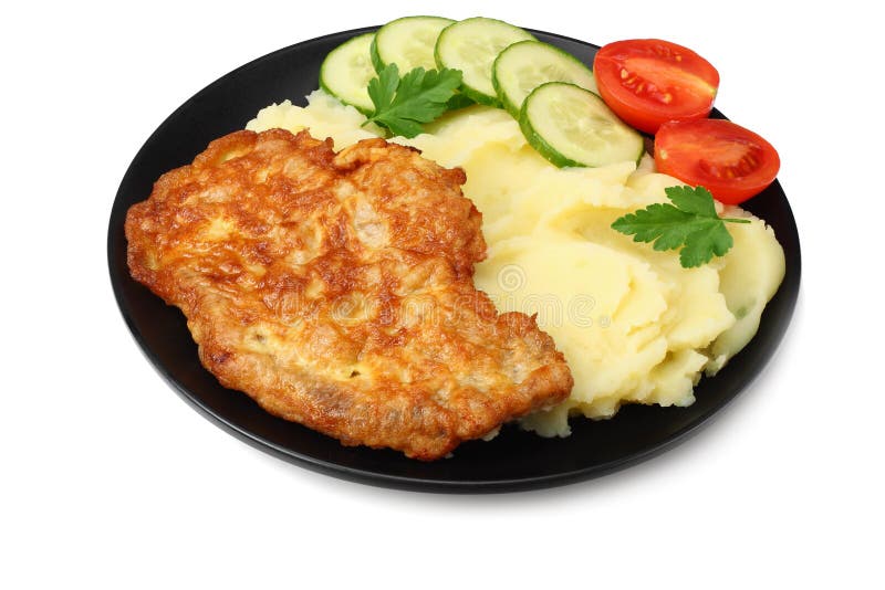 Mashed potatoes with schnitzel on black plate isolated on white background stock image Mashed potatoes with schnitzel on black plate isolated on white background stock image