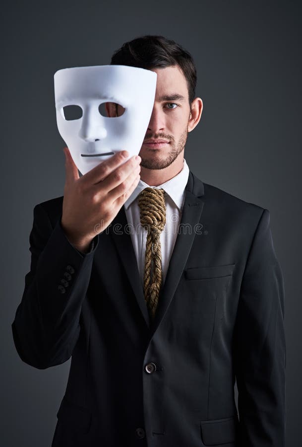 The Mask Can Be Misleading. Studio Portrait of a Young Businessman ...