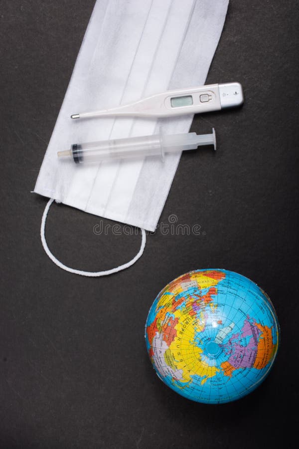 Mask, globe, syringe, thermometer Concept saves world from viruses. Coronavirus 2019 Pandemic. World epidemic concept. Mask, globes, gloved, syringe royalty free stock photography Mask, globe, syringe, thermometer Concept saves world from viruses. Coronavirus 2019 Pandemic. World epidemic concept. Mask, globes, gloved, syringe royalty free stock photography