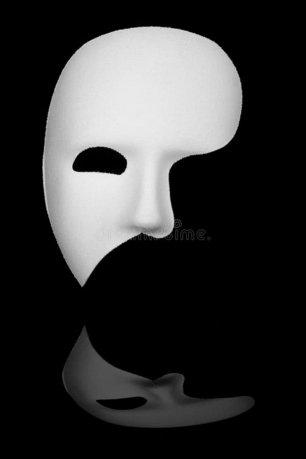 White phantom of the opera half face mask isolated on black background. White phantom of the opera half face mask isolated on black background