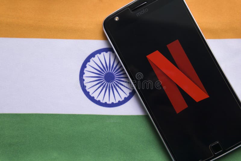 Maski, India - July 30, 2019: Netflix logo on Mobile with Indian Flag as background royalty free stock image Maski, India - July 30, 2019: Netflix logo on Mobile with Indian Flag as background royalty free stock image