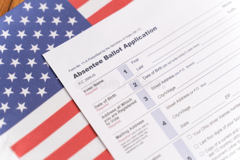 Maski, India - 23, June 2020 : Absentee ballot application on US flag for American Presidential elections.