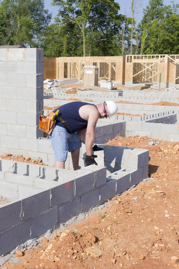 Mason with Concrete Block royalty free stock images