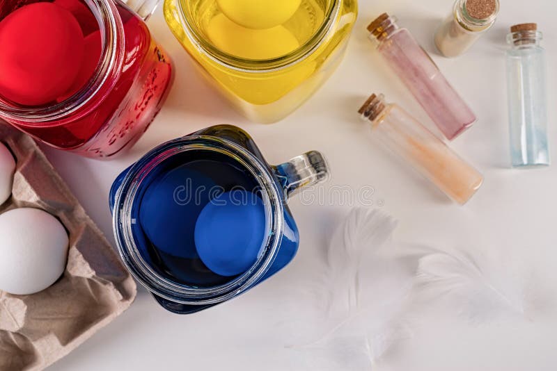 Mason jars with colorful eggs inside on the table royalty free stock photo Mason jars with colorful eggs inside on the table royalty free stock photo
