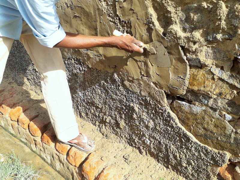 Mason Repairing Damaged Wall with Paste of Cement on a Site Stock Photo Image of material