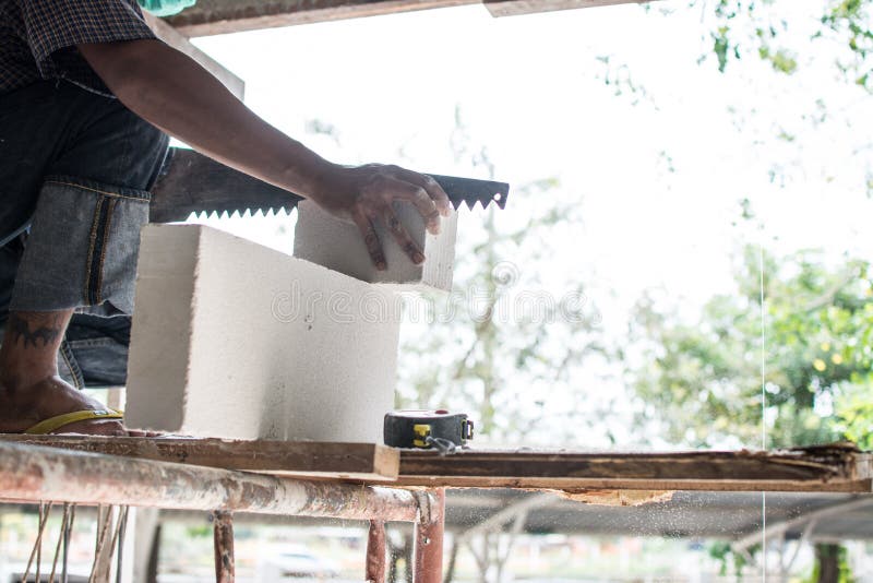 Mason Using Saw To Cut Brick Stock Image Image of work, site 219649525