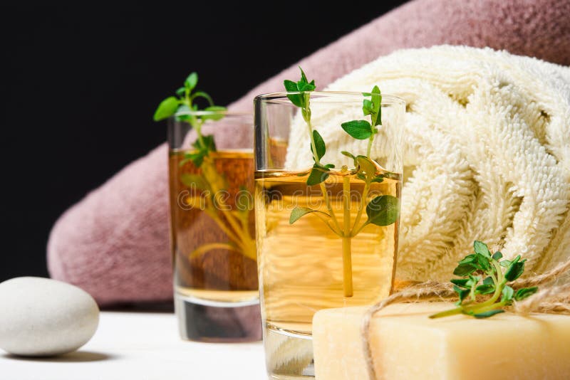 Massage or Aromatherapy Set Thyme, Oil, Stones and Soap Stock Image