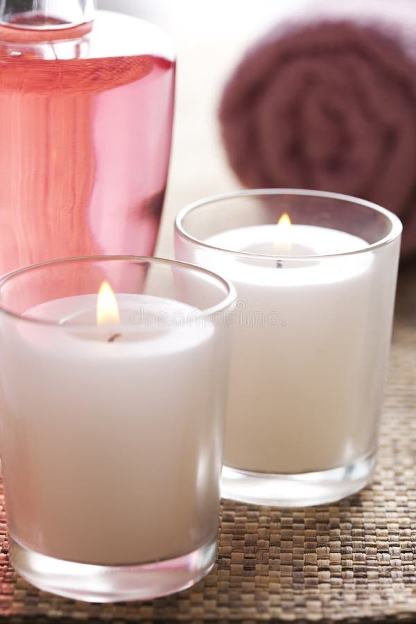 Massage oil and candles stock image. Image of packshot 11155333