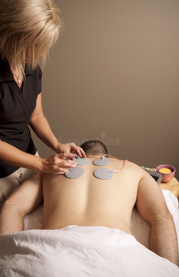 Massage Therapy Theme Stock Photo Showing a Man Receiving Electric