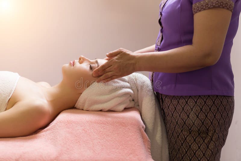 Masseur Doing Massage The Head Of An Caucasian Woman In The Spa Salon Stock Image Image Of