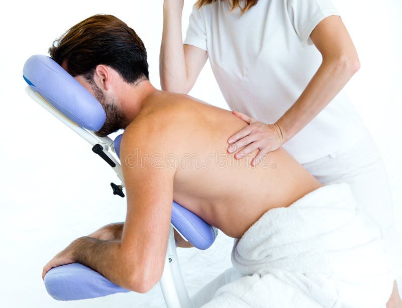 Masseur doing massage on man body in the spa salon. royalty free stock image Masseur doing massage on man body in the spa salon. royalty free stock image