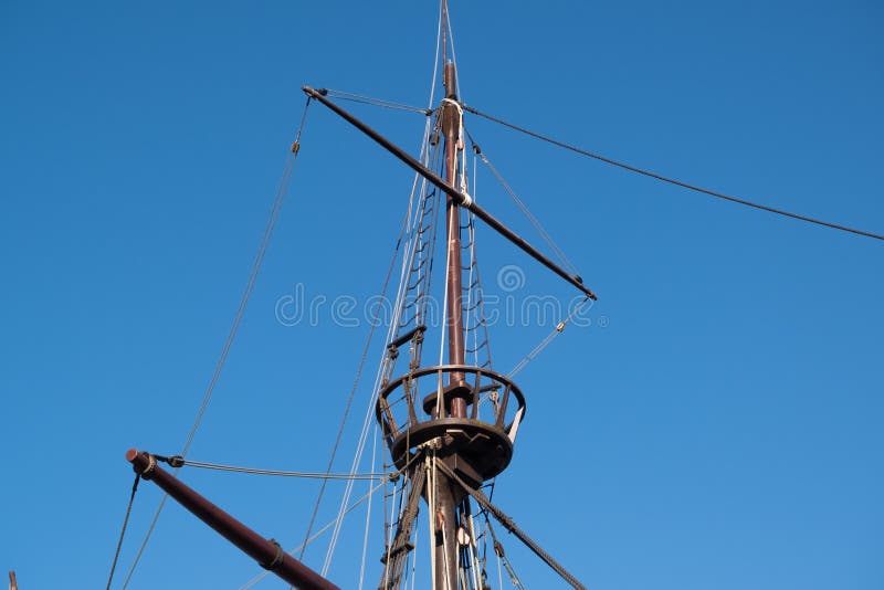 Mast, crow`s nest and rigging on replica of vintage 16th century sailing ship `Nau Quinhentista` in Vila do Conde, Portugal