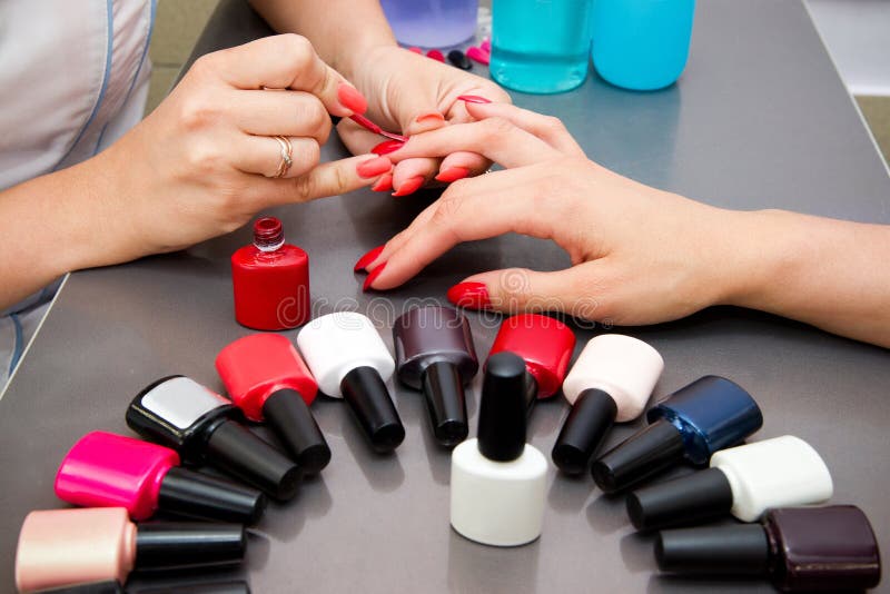 Master Applies Gel Polish on Nails in Manicure Salon Stock Photo ...