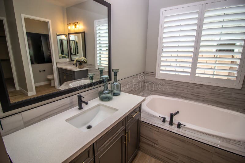Master Bathroom with Dual Vanities and Bath Tub Stock Photo Image of
