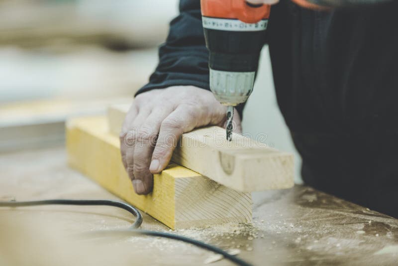 Master Carpenter Working on Woodwork Using Electric Tools Stock Image