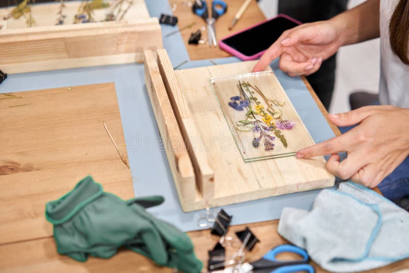 A Woman Fixes Glass Plates.. Master Class on Creating Frame with