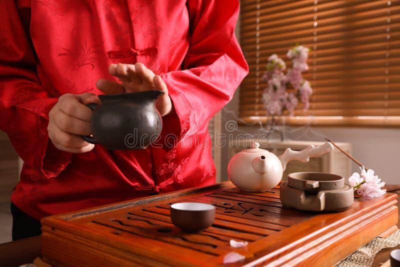 Master Conducting Traditional Tea Ceremony at Table, Closeup Stock